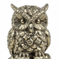 Pyrite owl macro detail showing glittering golden metallic crystal surface and intricate owl facial features