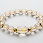 Energised Dhan Yog Bracelet Purnima close-up of glowing crystal beads on white background