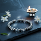 Metal Dhan Yog Bracelet Silver with cool moonlight tones in a serene spiritual setting