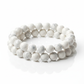 White howlite bracelet full shot on white background showing soft white beads with subtle grey veining