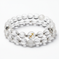 Dhan Yog Sagittarius Bracelet close-up of zodiac wealth crystal beads on white background