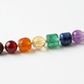 Seven Chakra Unisex Bracelet macro close-up showing seven distinct coloured crystal beads representing each chakra