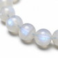 Moonstone Bracelet close-up of luminous milky moonstone beads on white background