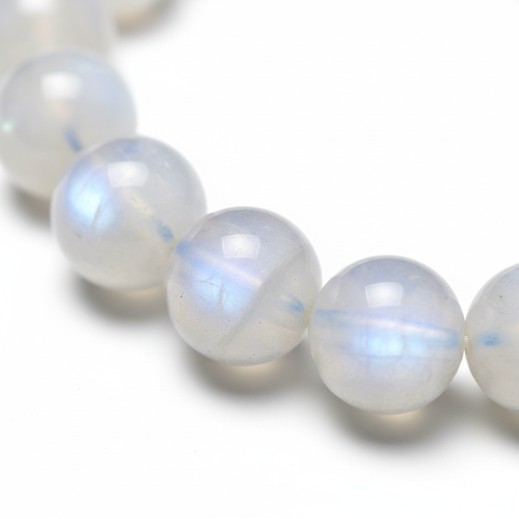 Moonstone Bracelet close-up of luminous milky moonstone beads on white background