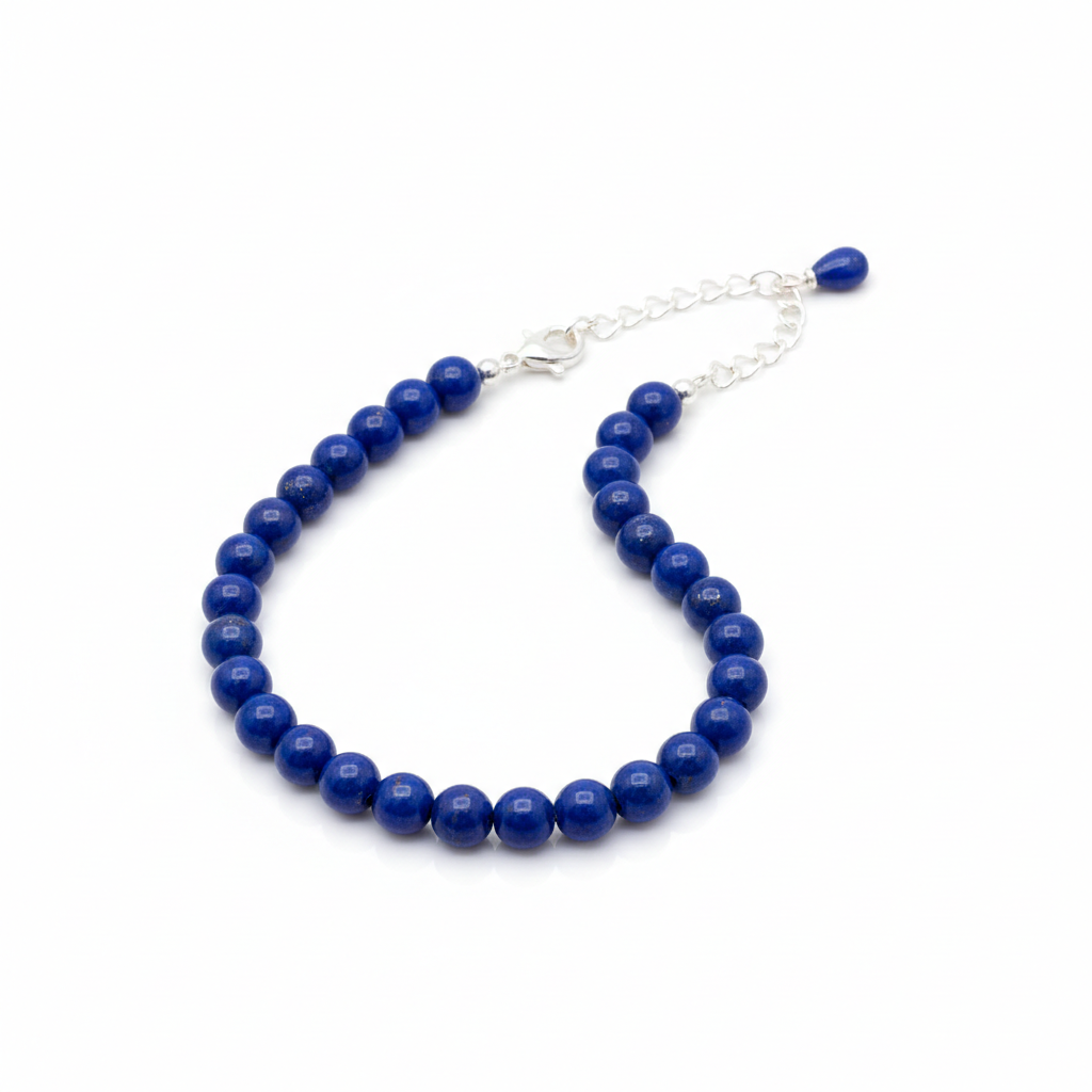Lapis lazuli anklet full shot on white background showing deep royal-blue beads with golden pyrite flecks
