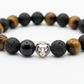 Triple Protection Bracelet macro close-up of black protective gemstone beads on white background