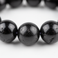 Black Tourmaline Bracelet macro close-up showing deep black natural bead texture and surface detail