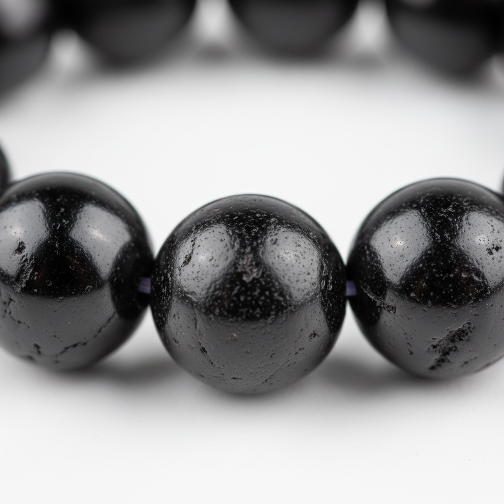 Black Tourmaline Bracelet macro close-up showing deep black natural bead texture and surface detail