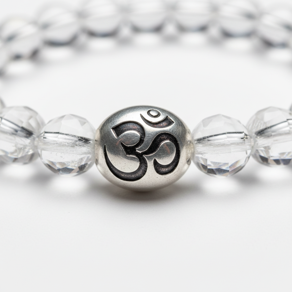 Wealth OM Bracelet macro close-up showing engraved OM symbol bead and crystal bead texture