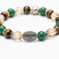 Money Magnet Bracelet close-up of abundance crystal beads on white background